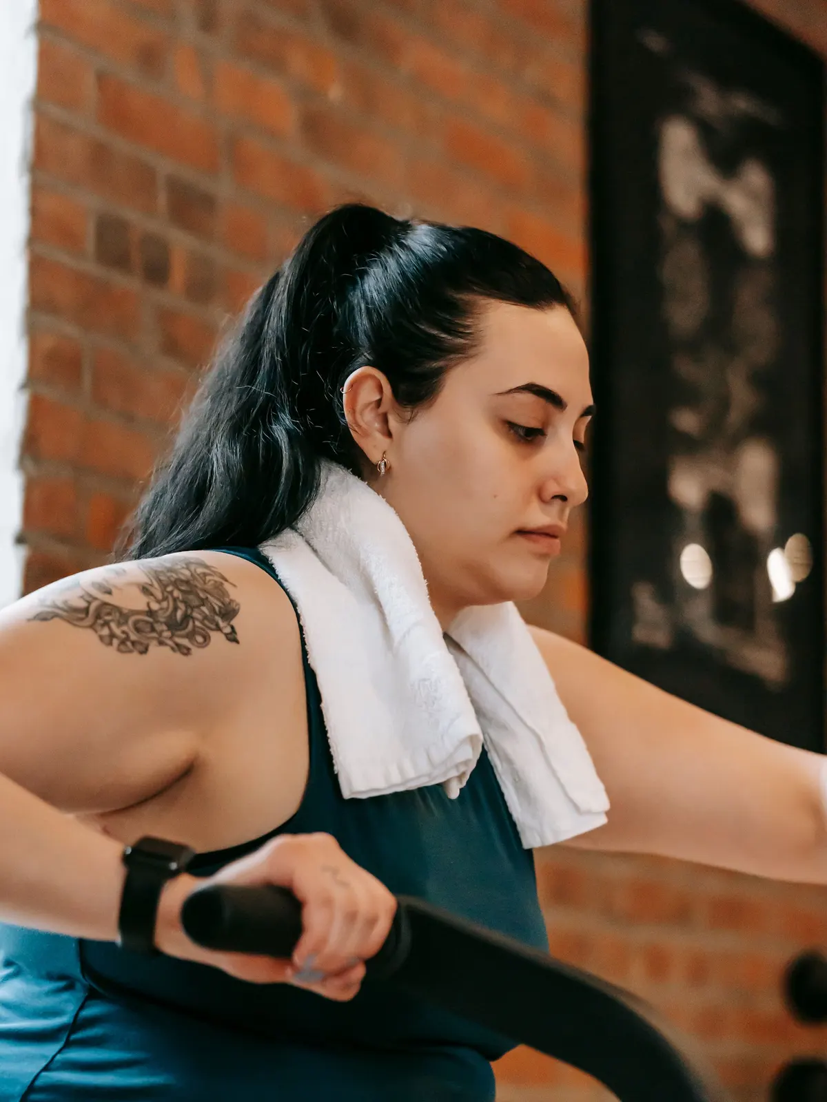 A trainer guiding a member through a set